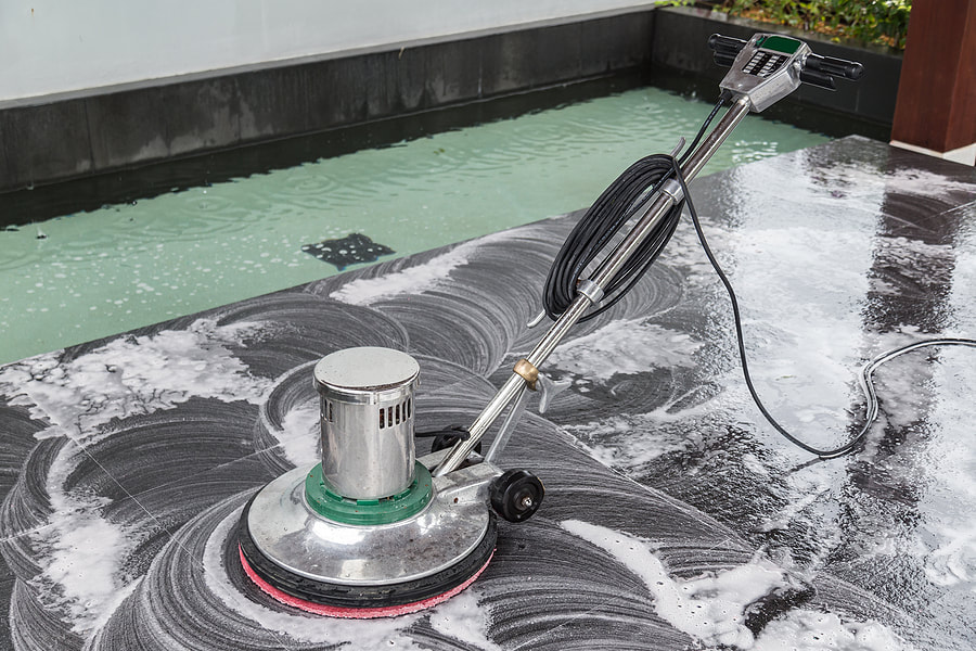 an electronic cleaner cleaning the stone flor